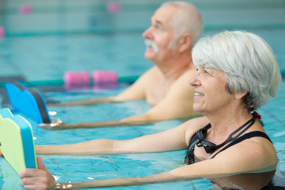 Seniors participating in water aerobics