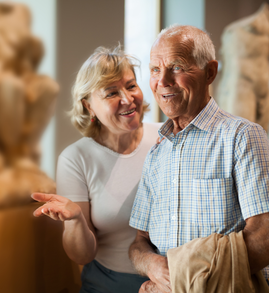 A close up of a senior couple at a museum